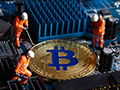 A golden coin sits on a motherboard. Three mini figurines surround the coin with tools. 